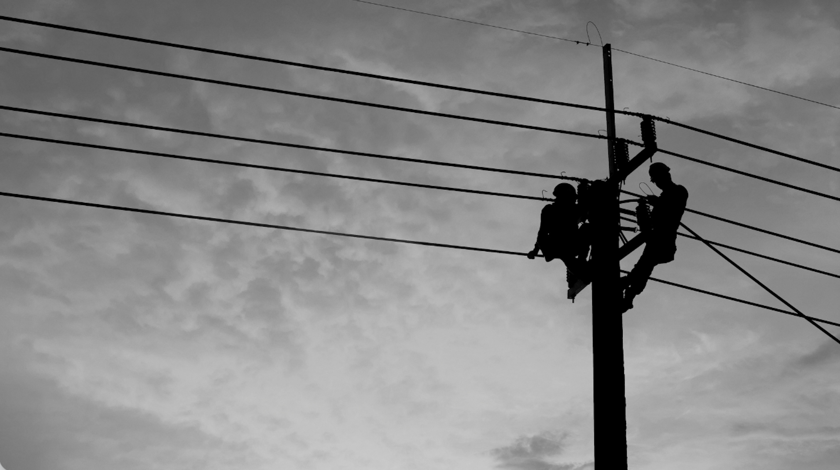 silhouette of linemen